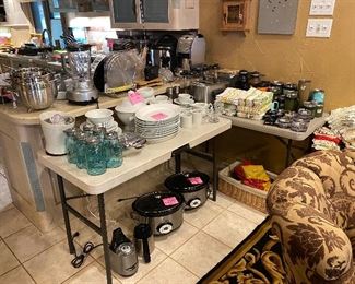 Tons of Yetis, All Clad Crock pots, dishes, appliances, cookware, Cast iron lodge pans, silverware, coffee makers, blenders, strainers, rice cookers, Microwave, toaster oven, utensils, pot holders and so much more!
