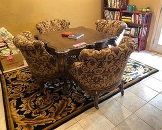 Game table with 4 upholstered chairs on castors