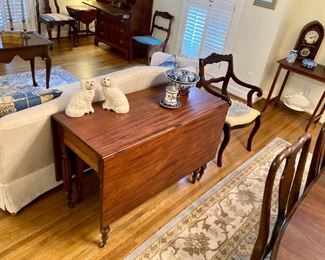 Drop leaf table with carved sunflowers