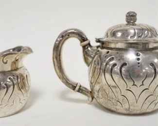 1009	STERLING SILVER TIFFANY & CO. TEAPOT & CREAMER, INSCRIBED UNDERNEATH & DATED 1894 16.2 TROY OUNCES 
