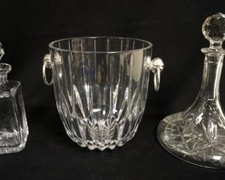 1019	CLEAR GLASS LOT INCLUDING ICE BUCKET W/ CHROME HANDLES, & TWO DECANTERS 
