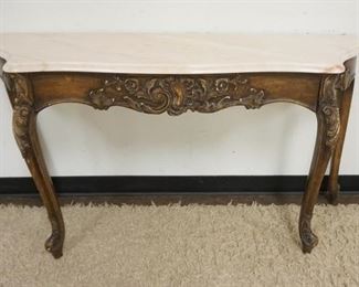 1024	ROSE MARBLE TOP DEMILUNE W/CARVED SKIRT & LEGS, APPROXIMATELY 55 IN WIDE X 16 IN DEEP X 30 IN HIGH

