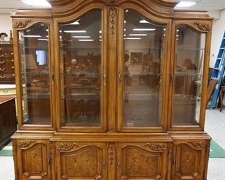 1030	KARGES WALNUT FRENCH PROVINCIAL BREAKFRONT W/ BURL WOOD PANELS & BEVELED GLASS DOORS & INTERIOR LIGHTING. APP. 81 IN W X 18 IN DEEP X 91 IN H 
