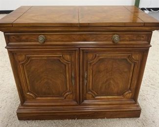 1032	KARGES WALNUT FLIP TOP LIQUOR SIDE BOARD W/ ONE DRAWER & TWO BURL PANELED DOORS. APP. 38 IN W, 20 IN DEEP, 32 IN H 
