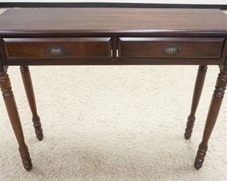 1033	NARROW WALNUT FINISH TWO DRAWER HALL TABLE. APP.  42 IN W X 13 IN DEEP X 34 IN H 
