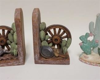 1063	LOT OF SOUTHWESTERN, IRON CACTUS DOOR STOP, POTTERY WAGON WHEEL BOOKENDS
