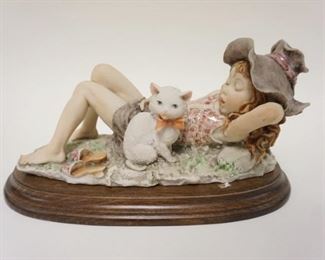 1064	G ARMANI FIGURE OF YOUNG GIRL SLEEPING W/HER CAT, APPROXIMATELY 12 IN LONG X 8 IN HIGH
