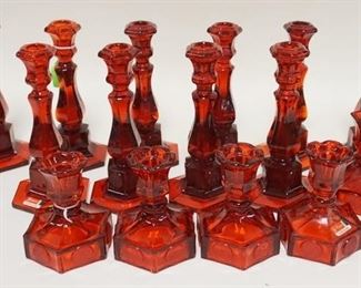 1087	15 RUBY RED FOSTORIA COIN GLASS CANDLE STICKS, TWO SIZES. TALLEST 8 IN H 
