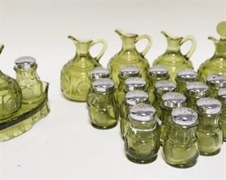 1097	FOSTORIA OLIVE GREEN CONDIMENT SET PLUS 16 EXTRA SALT & PEPPER SHAKERS & 5 PITCHERS 4 ARE MISSING STOPPERS. STOPPERS HAVE DAMAGE
