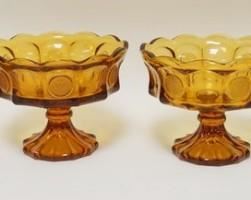 1103	4 AMBER FOSTORIA COIN GLASS COMPOTES 6 3/4 IN H 
