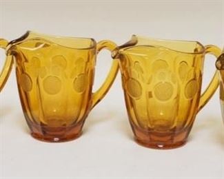 1108	4 AMBER FOSTORIA COIN GLASS PITCHERS 6 1/2 IN H 
