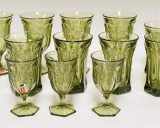 1111	LOT OF OLIVE GREEN FOSTORIA COIN GLASSES. LOT INCLUDES FIVE GOBLETS, SEVEN DRINKING GLASSES & THREE WINES. GOBLETS 6 1/2 IN H 
