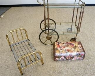 1130	3 PIECE LOT W/GLASS & BRASS TEACART, BRASS DOLL BED, & A DECOUPAGE SUITCASE, TEACART IS 33 IN WIDE X 14 3/4 IN X 35 IN HIGH
