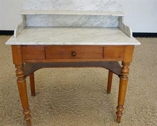 1139	MARBLE TOP ONE DRAWER TABLE, HAS MARBLE SPLASH & SHELF, TURNED LEGS, 35 1/2 IN WIDE X 17 1/4 IN DEEP X 38 IN HIH
