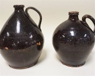 1167	2 EARLY OVOID REDWARE JUGS, SMALLER HAS RIM & BASE CHIPS, LARGER IS 10 1/2 IN & HAS MINOR BASE CHIPS
