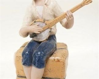 1255	PORLANA ARTISTICA LEVANTINA FIGURE OF A BOY PLAYING A BANJO, SPAIN, 10 1/8 IN HIGH
