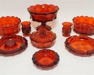 1288	9 PIECE RED FOSTORIA COIN, 8 3/4 IN COMPOTE, 2-7 3/4 IN BOWLS, 3 ASHTRAYS, 2 CIGARETTE HOLDERS & A COVERED BOWL
