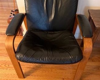 One of a pair of leather and bent wood arm chairs from Scan formerly in Hyde Park