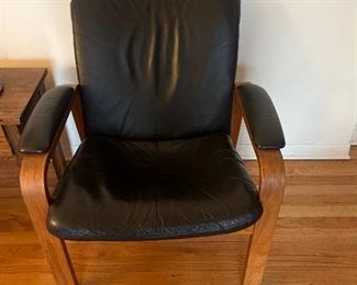 One of a pair of Black Leather bentwood Arm chairs