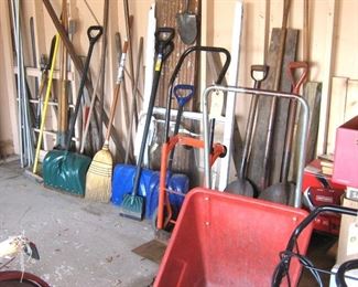 A garage full of gardening/yard supplies