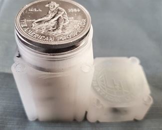 US Double Eagle gold coins and many other early US silver coins, Canadian Maple Leaf gold coins, and  tubes of 25 silver American Prospector rounds. 