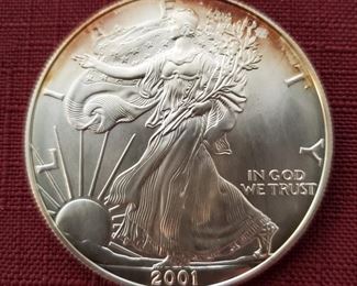 US Double Eagle gold coins and many other early US silver coins, Canadian Maple Leaf gold coins, and  tubes of 25 silver American Prospector rounds. 