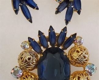1960s Juliana Brooch & Earrings Blue Gold Filigree. 2" long Juliana (Delizza & Elster) brooch with sapphire blue oval rhinestone center accented with sapphire blue open back navette rhinestones, aurora borealis rhinestones and goldtone filigree balls. Also includes the matching clip earrings.