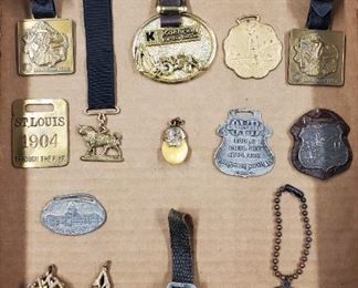 16 Watch Fobs 1904 Fair Elks CAT Bull Durham Etc. Includes antique fobs from the 1904 St. Lous World's Fair, oilfield companies, MT Woolgrowers, Bull Durham tobacco, Caterpillar, BPOE Elks tooth fob, and more.