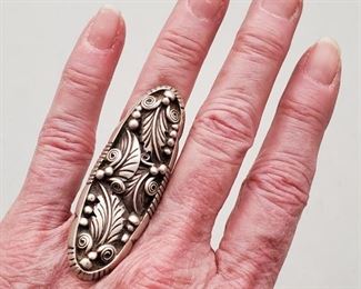Vintage Navajo Sterling Silver Ring Harrison Yazee. Size 7. Ring is 2 1/2" long and 1" wide. It is signed H and the word Sterling in script. I believe this mark was used by Navajo silver artist Harrison Yazee.