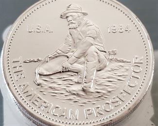 US Double Eagle gold coins and many other early US silver coins, Canadian Maple Leaf gold coins, and  tubes of 25 silver American Prospector rounds. 