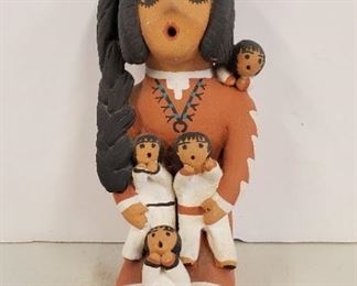 5" Pueblo Storyteller Doll Anita Cajero Jemez. By well known Jemez Pueblo potter Anita Cajero, who specializes in storyteller dolls and friendship pots. She was born in 1965, and was the fourth generation of her family to create pottery. She first exhibited at the Santa Fe Indian Market in 1985. 