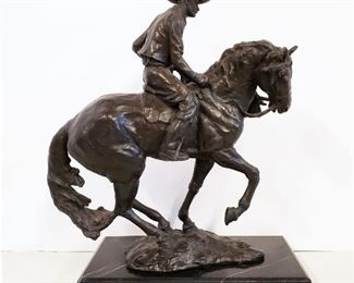 Bronze Sculpture Cowboy on Horse on a black marble base. 15" long, 12" tall, and 5" wide. Circa 1970's. By American artist Donald Rubin, who was born in 1934.