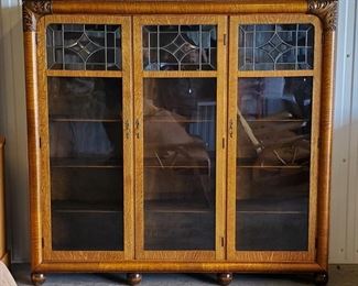 Beautiful antique tiger oak three door bookcase with leaded glass doors