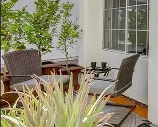 Front patio set with aloe and citrus trees in post