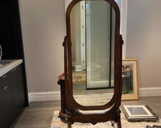 Antique dressing mirror on stand. Measures 70” H x 24” D x 27” W. 