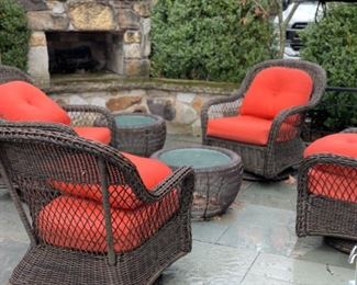 Set of four all weather woven wicker swivel rocker chairs with new cushions.  Photo 1 of 2. 