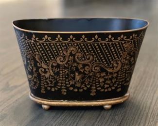 Ebony and gilt cachepot. 