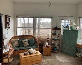 Wicker patio set cream cabinet bookshelves side tables candles