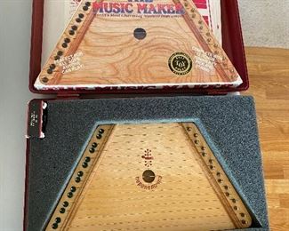 The Music Maker musical instrument with sheet music