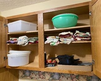 Tupperware and dish towels and hot pads
