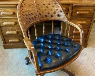 Bassett Cane Back Swivel Leather Bottom Chair