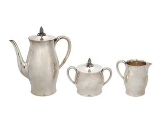 1006
A Tuttle "Paul Revere" Sterling Silver Coffee Service
20th Century
Each marked for Tuttle sterling; Further marked: 395 / P. Revere Pattern
Each designed with pineapple finials, comprising a coffee pot (9.25" H x 8.25" W x 4.5" D), creamer (4.5" H x 4.75" W x 3.25" D), and a covered sugar bowl (5" H x 6" W x 4" D), 3 pieces
41.24 oz. troy approximately
Estimate: $500 - $700