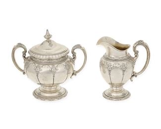1020
A Towle "Royal Windsor" Sterling Silver Creamer And Sugar Pot
20th Century
Each marked for Towle; Further marked: Sterling / 76420
Each with rocaille and floral motifs, comprising a large covered sugar bowl (7.5" H x 7.75" W x 5" D) and a creamer (6.25" H x 5.5" W x 3.375" D), 2 pieces
31.165 oz. troy approximately
Estimate: $600 - $800