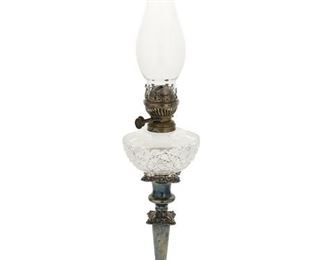 1023
A Sheffield Silver Plate Peg Lamp
19th Century
With an English cut glass oil lamp and hurricane on a weighted, Rococo-style silver plate candlestick base
22.75" H x 4.5" Dia.
Estimate: $300 - $500