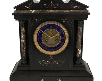 1027
A Victorian Slate And Marble Mantle Clock
19th Century
Movement marked: AA [with hourglass]
With a blue enamel dial, gilt Roman numeral hour markers and outer minute track, and two train movement set in an architectural slate case with brown marble accents and intaglio decorations
17.375" H x 14" W x 6.625" D
Estimate: $400 - $600