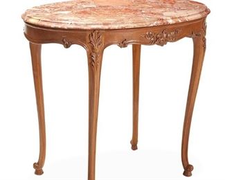 1037
A Louis XV-Style Table
20th Century
The small table with pink, oval marble top over a floral motif carved wood structure
28.25" H x 32.25" W x 21.75" D
Estimate: $300 - $500