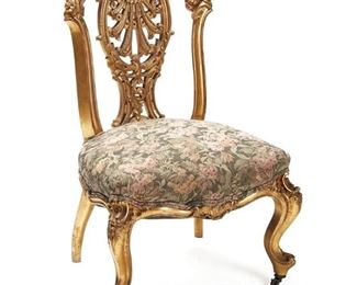 1038
A French Louis XV-Style Carved Giltwood Chair
20th Century
The rocaille motif carved giltwood carcass with openwork backsplat over an upholstered stuff seat
37" H x 23" W x 20" D
Estimate: $300 - $500