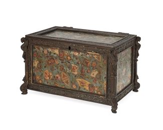 1042
A French Jewelry Casket/Humidor
Late 19th/Early 20th Century
The lidded bronze box with lithograph transfer tin panels with polychrome Chinoiserie-style floral design and wood-lined interior
5.5" H x 9.5" W x 6" D
Estimate: $300 - $500