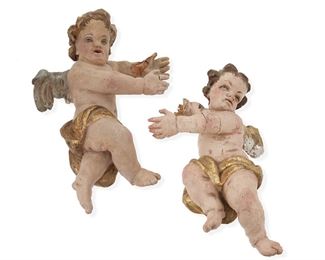 1043
A Pair Of Carved Wood Putti
20th Century or earlier
Each carved wood putto painted and with gilt highlights, 2 pieces
Each: 15.5" H x 8" W x 9.25" D approximately
Estimate: $300 - $500
