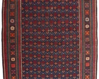 1049
A Caucasian Area Rug
First-Quarter 20th Century
Wool on wool foundation, with polychrome geometric motifs
70.5" L x 45" W
Estimate: $300 - $500